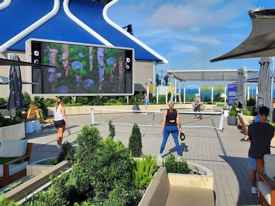 Guests playing pickleball in the Rooftop Garden