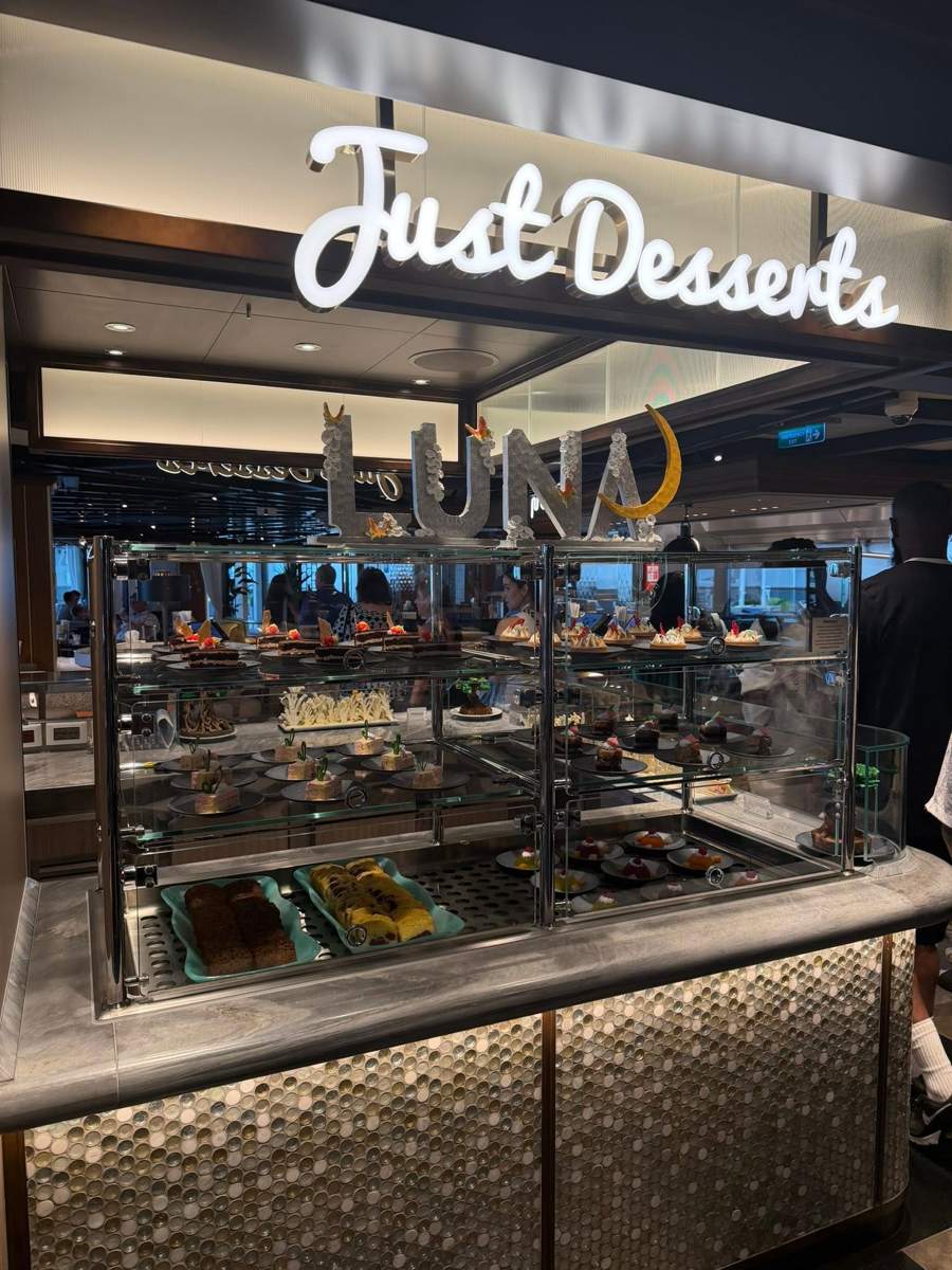 The Just Desserts display case with the Luna sign above it