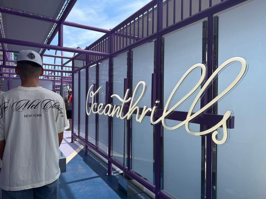 The Oceanthrills sign on a purple wall